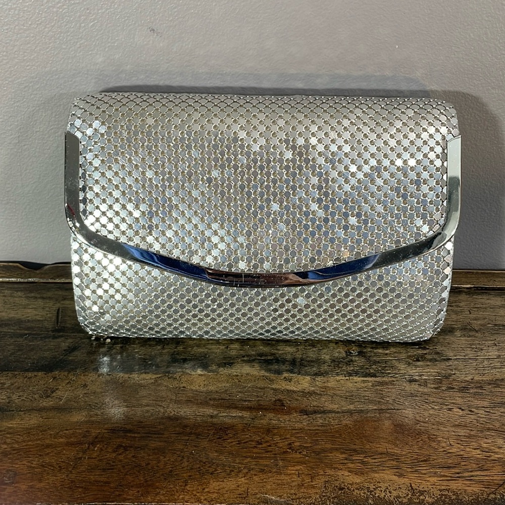 Mind Handbags Incorporated shiny silver clutch purse with chain - some staining
